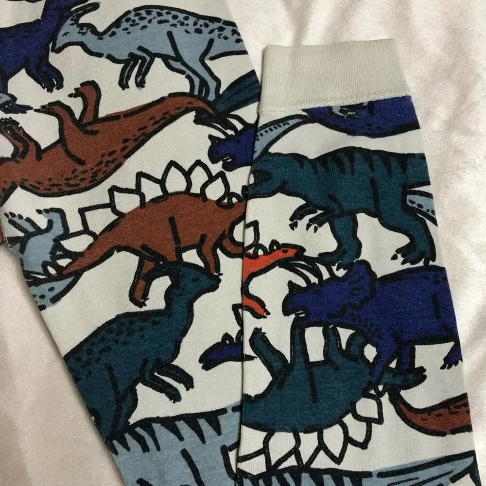 Hanna Andersson off white multicolor dinosaur pajamas size 140 or US 10